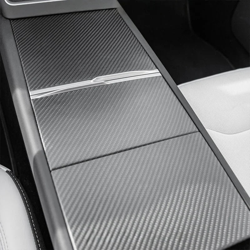 Close view of carbon trim adding depth and luxury to the interior.