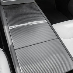 Close view of carbon trim adding depth and luxury to the interior.