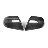 Genuine carbon fibre rear view mirror covers for the 2024 Tesla Model 3 Highland, shown as a high-gloss pair against a white background.