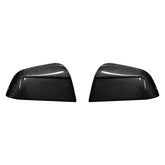 Genuine carbon fibre rear view mirror covers for the 2025 Tesla Model Y Juniper, shown as a high-gloss pair on a white background.