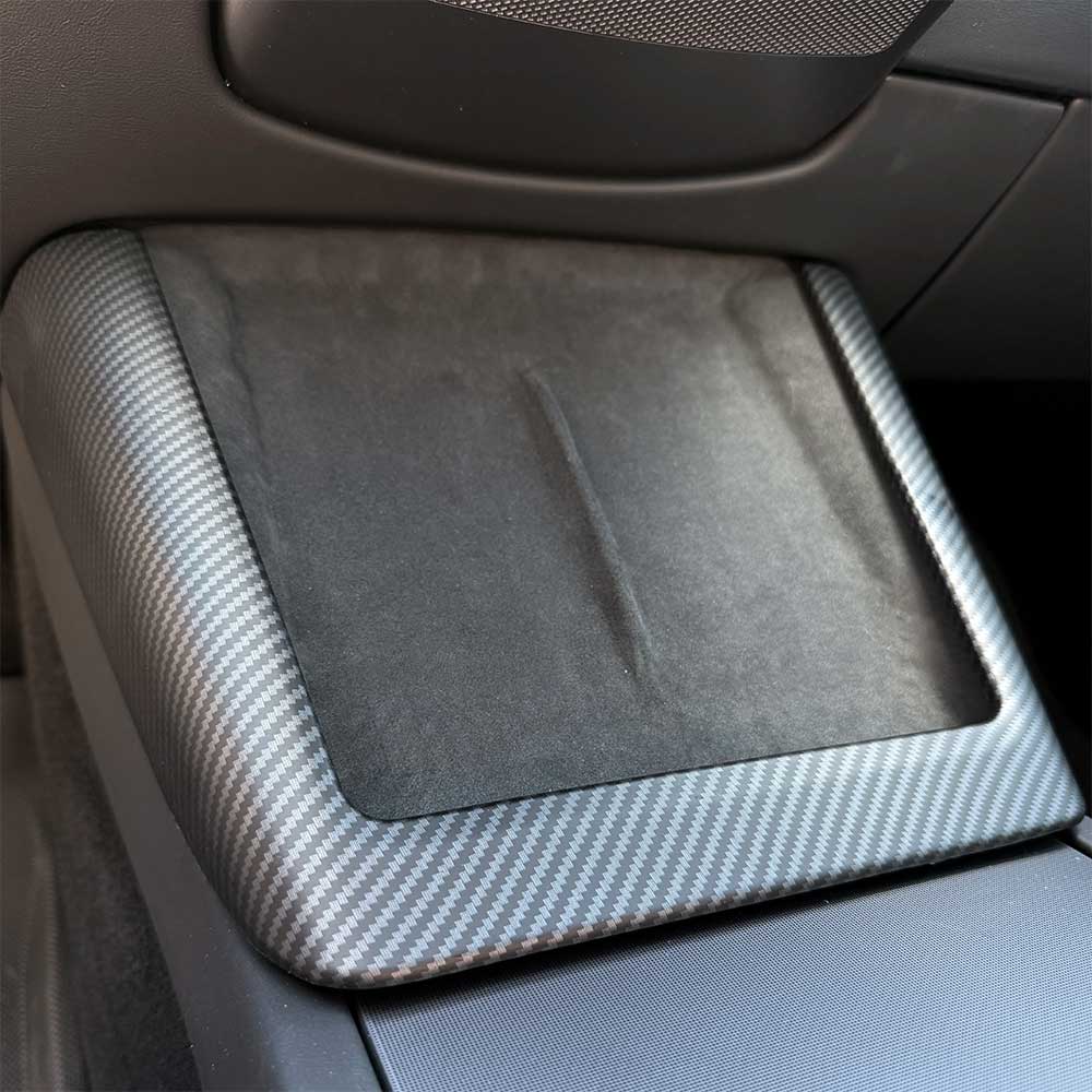 Car console with a carbon fiber patterned cover