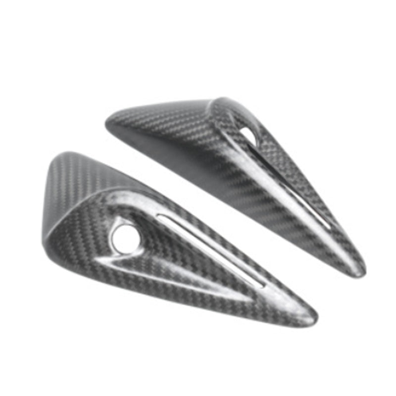 Precision-molded carbon fiber covers with smooth edges and cutouts.