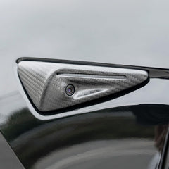 Close-up showing camera opening and seamless carbon fiber integration.