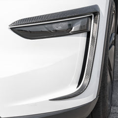 Close-up of carbon trim enhancing the headlight line and depth.
