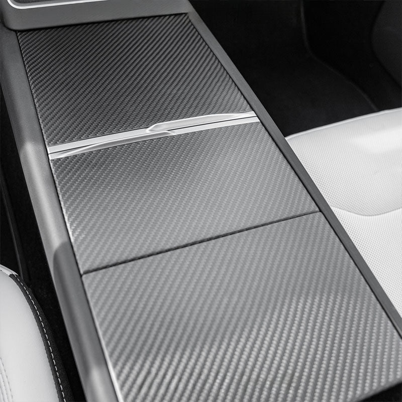 Close view of carbon trim adding depth and luxury to the interior.