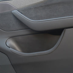 Top view of door storage tray fitted inside the front door compartment of Model Y L